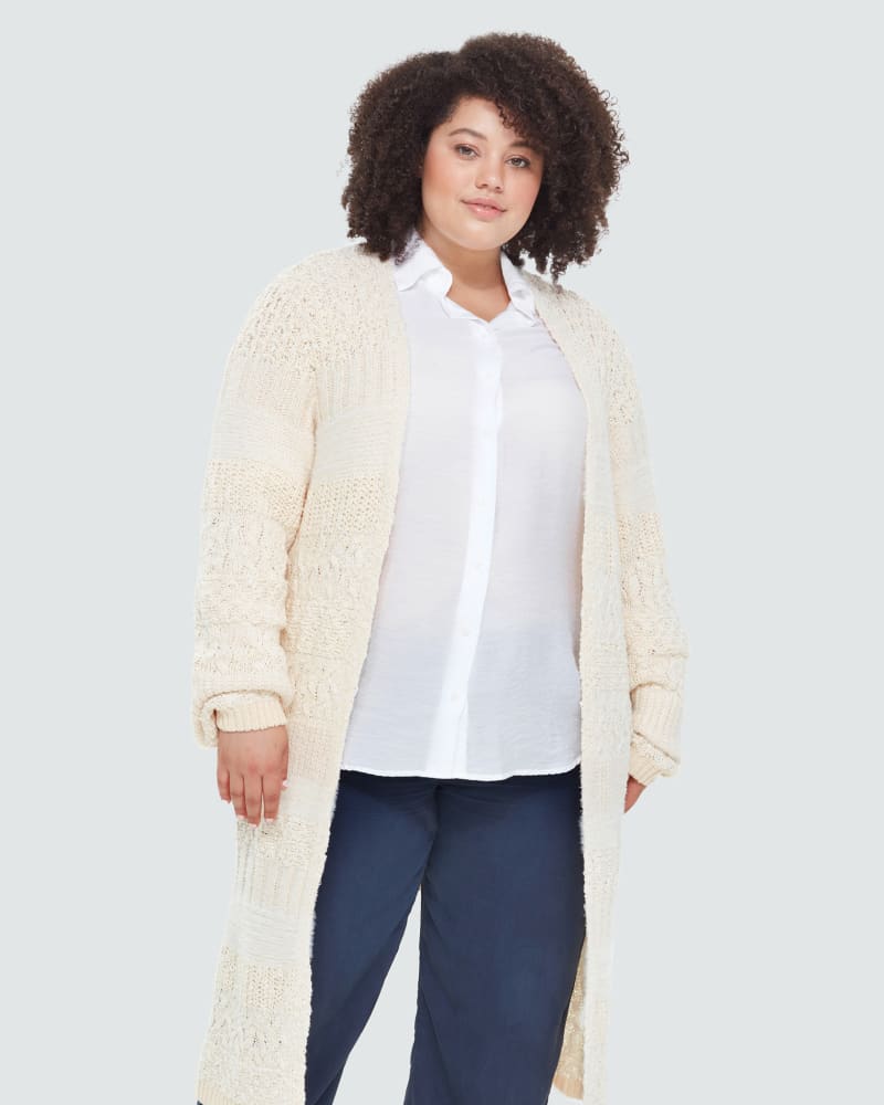 Front of a model wearing a size 1X Bria Longline Textured Cardigan in Ivory by DEX PLUS. | dia_product_style_image_id:260512